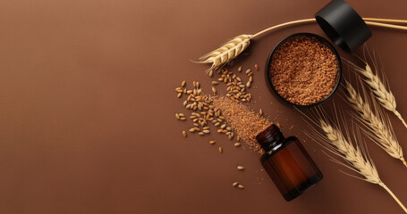 wheatgerm skincare products with grains, crushed bran and brown glass bottles on brown backdrop, free space for text 