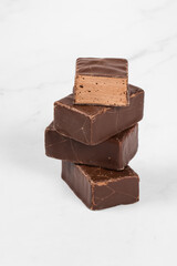 Delicate dessert. Chocolate souffle in chocolate glaze. White background. Close-up