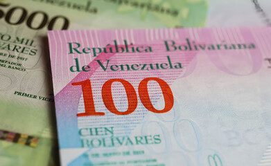 Closeup of old Venezuela central bank 100 Bolivar currency banknote (focus on center) - obrazy, fototapety, plakaty