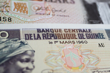 Closeup of old Guinea central bank GNF Franc currency banknote from 60s (focus on center)