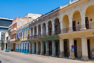 Fototapeta na wymiar Historic buildings on Paseo del Prado between Calle Genios and Refugio Street in Old Havana (La Habana Vieja), Cuba. Old Havana is a World Heritage Site. 