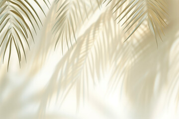 Blurred shadow from palm leaves on light cream wall. Minimalistic beautiful summer spring background for product presentation