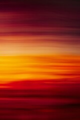 Red and Yellow Sky With Distant Plane