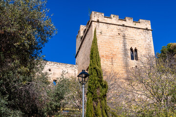 Historic Castle Tower in Denia, Spain with Blue Sky