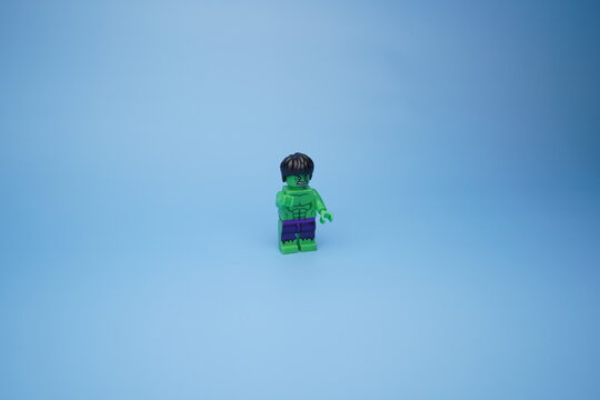 Lego Hulk isolated against an empty blue background