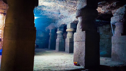 old stone pillars in the jogeshwari caves in mumbai in india.