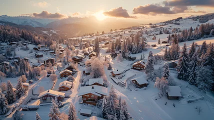 Fotobehang A sweeping aerial panorama of a snow-covered mountain village at dawn. © Thomas