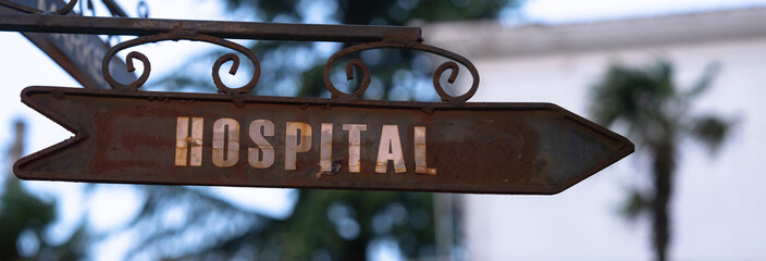 The inscription hospital on an iron sign