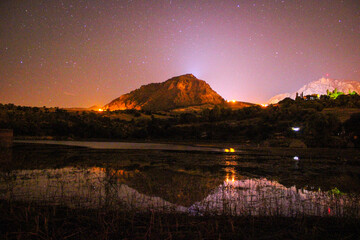 star exposure at night time. astrophotography. galaxy Reflection of the mountain in the river....