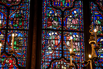 Paris, France - Dec. 27 2022: The stunning stained glass window and the beautiful ceiling in...