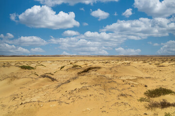 Fototapeta na wymiar Beautiful desert landscape with blue sky at Cabo de Vela. La Guajira, Colombia.