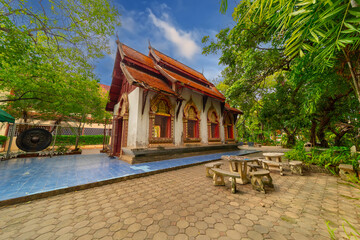 Beautiful Wat Buddhist temples in Chiangmai Chiang mai Thailand. Decorated in beautiful ornate colours of red and Gold and Blue. Lovely sunset