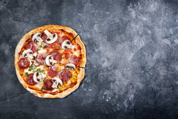 Sliced pizza on dark background - 749014287