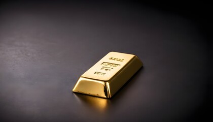 Gold bar isolated on dark background
