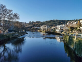 View of the thermal area of S. Pedro do Sul, Vouga River and buildings on the banks of the river supporting thermal spas, hotels and others, Viseu, Portugal - obrazy, fototapety, plakaty