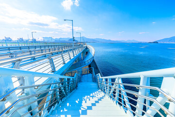 冬の新北九州空港連絡橋　福岡県京都郡　New Kitakyushu Airport connecting bridge in winter. Fukuoka Pref, Miyako-gun. - obrazy, fototapety, plakaty