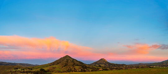 Fototapeta na wymiar Panorama of mountain peaks at sunrise, sunset