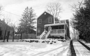 suburban house after the snow storm in black and white