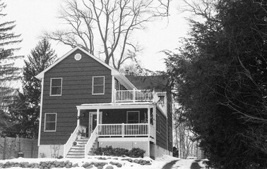 suburban house after the snow storm in black and white