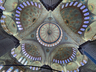 ceiling of the blue mosque in istanbul, with its colorful stained glass windows, impressive ceiling...