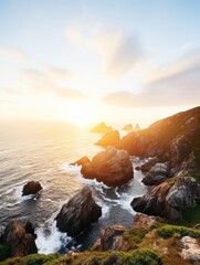 Obraz premium a rocky coastline with the sun setting
