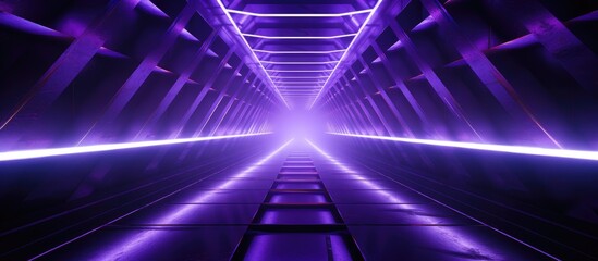 Fototapeta premium A dark tunnel is illuminated by rows of purple neon lights, creating a futuristic and sci-fi atmosphere. The lights create a surreal and fluorescent glow, giving the tunnel an otherworldly feel.