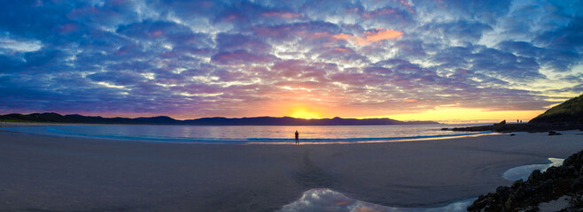 Lone figure on a beach with beautiful sunset, Spirits Bay, Northland, New Zealand