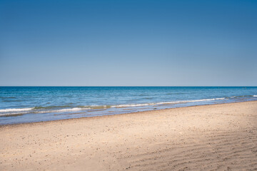 Fototapeta na wymiar Happisburgh sandy beach on a sunny spring day, Norfolk, England; can be used as a bakground