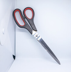 two plastic scissors on the white background