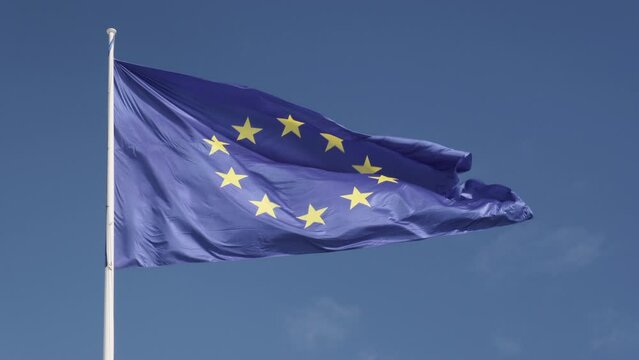 European Union flag waving with sky in background