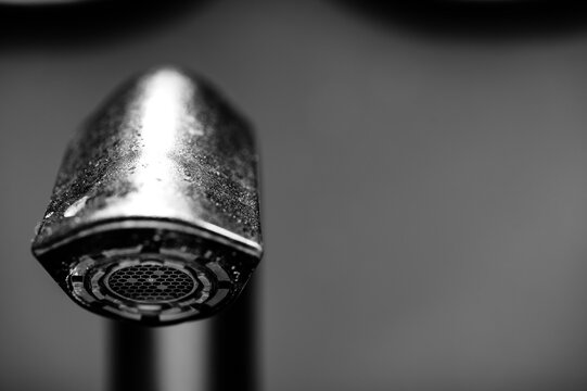 Underside of a bathroom sink aerator on a faucet.