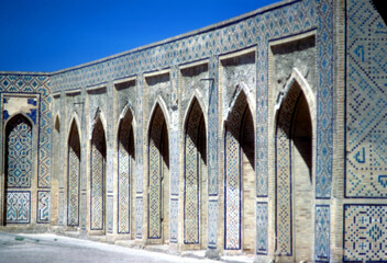 Mosaic tiled arches in mosque courtyard
