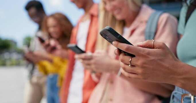 Hands, students and group with phone for texting, mobile app and typing for search, meme or web blog. People, men and women with smartphone for social media at university with connectivity in Atlanta