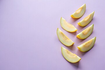 Pieces of sweet melon on lilac background with copy space