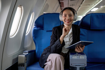 Young Asian executives are first class. Multitask with digital tablets, laptops and smartphones....