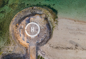 Helicopter landing site, helipad, on Sanur Beach, Bali, Indonesia, seen from above. Sanur Beach is a famous tourist location on the island of Bali.