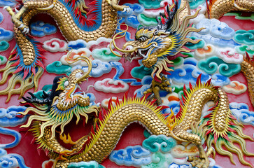 Fototapeta premium Dragon, head sculpture on wall of temple in Thailand, Symbol of wealth, prosperity.