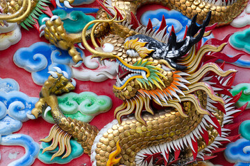 Dragon, head sculpture on wall of temple in Thailand, Symbol of wealth, prosperity.