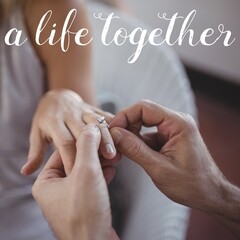 Celebrating a union, a close-up of hands with an engagement ring symbolizes commitment and love
