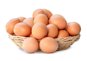 Front view of fresh brown chicken eggs in stack in woven bamboo basket isolated with clipping path and shadow in png file format
