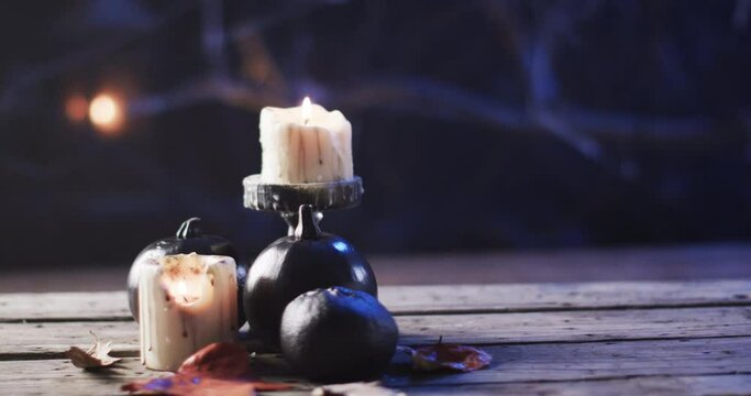 Candles provide a warm glow on a rustic wooden surface