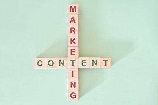 Content marketing strategy concept. Crossword puzzle flat lay typography in green background.