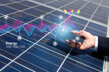 Engineer or electrician uses a smartphone to inspect or maintain a solar panel used in home or...