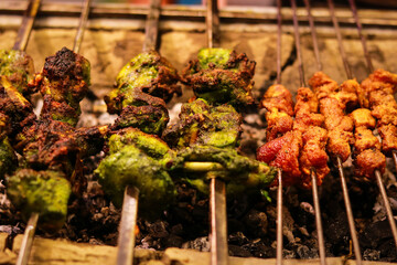 Grilled chicken skewers on a barbecue grill, close-up, Famous Food, Street Food