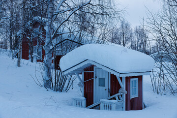 Fairy cubby house with pony outside in frosty Muonio in deep Winter in northern Finland, above the arctic circle