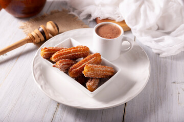Churros. Fried wheat flour dough, a very popular sweet snack in Spain, Mexico and other countries where it is customary to eat them for breakfast or snack accompanied by hot chocolate or coffee.