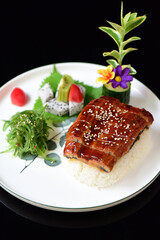 Delicious seafood and eel rice placed on a plate