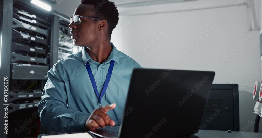 Poster Man, laptop and coding in server room as software engineer and information technology in data centre. Developer, analysis and happy on computer for work and it infrastructure for network programming
