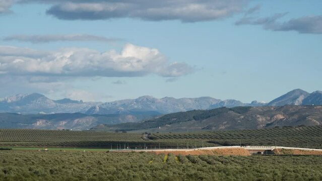 Timelapse of mountains in the south of Spain with countryside in foreground