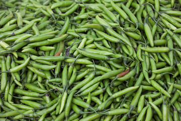 green chili peppers for sale at farmers market
